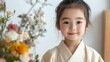 © chic designs - 春休みの展示に向けて生け花の芸術を練習する日本の子供