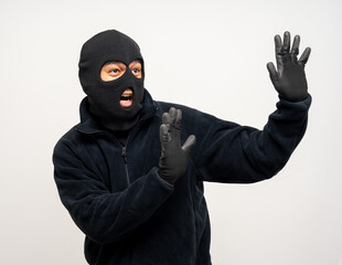 Wall Mural - Thief in uniform black jacket various pose on isolated background. The Robber terrorism criminal escapes with balaclava and crowbar entering a house for stealing Housebreak