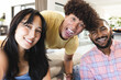 © Wavebreak Media - Smiling diverse friends hanging out at home, enjoying time together and having fun