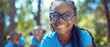 © Natalia - A girl with glasses smiles for the camera. AI.