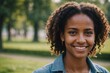 © ThomasLENNE - Close portrait of a smiling young Eritrean woman looking at the camera, Eritrean outdoors blurred background