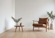 © Sharif54 - A minimalist living room with a wooden armchair, a low wooden coffee table, and a decorative branch in a vase on the floor.