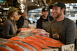 © daejang - People selling salmon and various fish in a traditional fish market, having fun with customers.