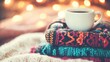 © tashechka - A warm coffee sits atop vibrant, knitted blankets, inviting relaxation in a cozy reading nook filled with books
