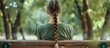 © 2rogan - Emotional Girl Teenager With Long Hair Hairstyle Braids In A Green Shirt Sits On A Bench In The Park