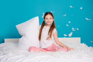 Sticker - Photo of pretty lovely cute girl sitting comfy bed relax rest isolated on blue color background