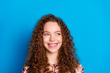 Wall Mural - Photo portrait of lovely young lady cheerful look empty space dressed stylish colorful garment isolated on blue color background