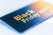 © Sunday Cat Studio - Black Friday sales card on a blurred background, symbolizing holiday shopping and discounts for eager consumers.