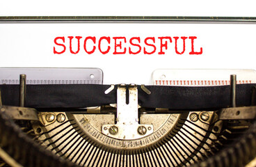 Successful symbol. Concept word Successful typed beautiful old retro vintage typewriter. Beautiful white paper background. Business successful concept. Copy space.