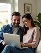 © Global Perspectives - A couple searching house to rent on a laptop Real Estate home listing buying or selling home