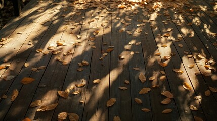 Sticker - A wooden deck scattered with autumn leaves, illuminated by soft shadows.