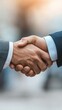 © pornsawan - Attractive Businessman handshake for teamwork of business merger and acquisition,successful negotiate,job interview,two businessman shake hand,partnership and business deal concept Greeting deal.