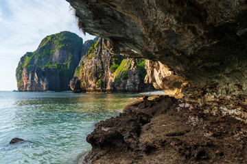 Stone arch cave and limestone mountain  and sea at Maya beach, Krabi