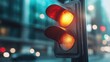 ©  Jovaduplex - An amber traffic light is illuminated in an urban night scene with blurred city elements, providing an atmospheric view highlighting caution and vigilance in traffic signals.