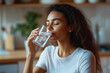 © Kseniya - Closeup of young african woman drinking cool sparkling mineral water from glass hydrate having pleasure. Dehydrated black female feel thirsty drink swallow cold still aqua keep detox weight loss diet