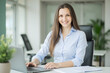 © Amir Bajric - business woman sitting at the laptop in the office