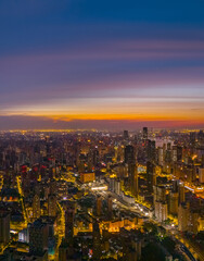 Aerial view of modern city skyline and buildings at sunrise in Shanghai