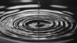 © vimp - A solitary droplet touching the surface creates mesmerizing circular ripples