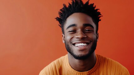 Wall Mural - A young man with dreadlocks smiles broadly at the camera.