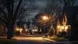 © วรรณภา มะโนศรี - A peaceful suburban street at night, with houses adorned with soft exterior lights and trees casting shadows, creating a serene and inviting nighttime scene.