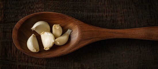 Canvas Print - Garlic In A Wooden Spoon