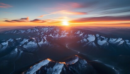 Wall Mural - stunning aerial view of mountains bathed in the warm glow of sunset