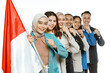 © Odua Images - patriotic students smiling while standing and holding indonesian flag with fist hand gesture