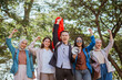 © Odua Images - patriotic students with raised fist celebrate independence day and holding indonesian flag and megaphone