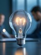 © Wonder Photo - A glowing light bulb symbolizes innovation, creativity, and problem-solving. It represents the power of ideas to illuminate the path towards achieving business goals.