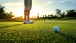 © hanisah - Man playing golf standing on grass