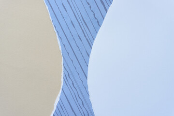 Wall Mural - curvy torn paper background (beige, blue with stripes, and plain)