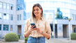 © PeopleVideos - Happy woman coming back from work and surfing the net