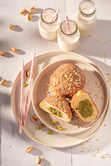 Wall Mural - Homemade and yummy pistachio donuts as a lunch snack.