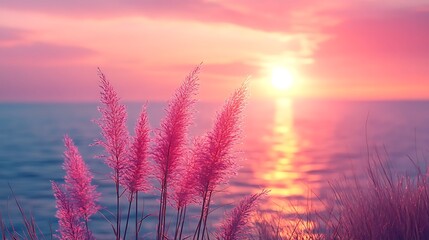 Wall Mural - silhouetted grasses sway in the gentle breeze as the sun sets over the ocean, casting a warm glow on