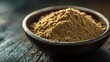 © Supriyanto - A close-up of a bowl filled with brown powdered spice on a wooden surface.