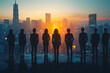 © Nathasa - Silhouette group of businessmen and businesswomen stand together with a highrise city in the sunset background.