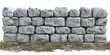 © Collection - A weathered stone wall with a natural, rugged texture and a grassy base