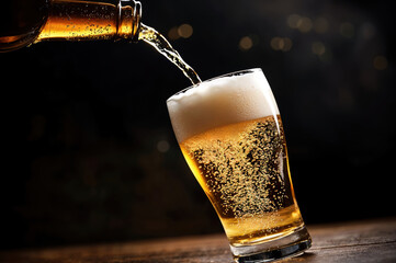 Poster - Pouring beer into glass with bubbles and foam on top