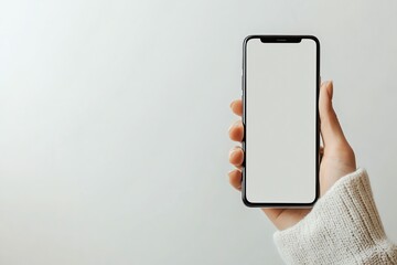 Poster - A woman's hand holds a black smartphone with a blank white screen against a white background.
