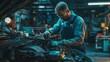 © phattharabodin - A car mechanic in overalls inspecting a vehicle's engine, using tools and diagnostic equipment in a brightly lit garage.