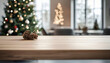 © Daniel - Wood dining table with copy space and christmas tree in the background