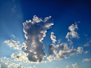 Wall Mural - Clouds in the blue sky. Nature background. Sky with clouds.