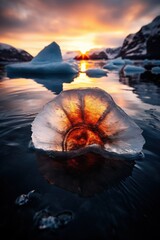 Poster - Glowing ice crystal at sunset in frozen landscape