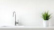 © Rosnani - Modern kitchen sink with a plant decoration.