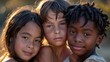© P - A warm close-up of three kids from different ethnicities, smiling together
