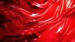 © lertsakwiman - Abstract red liquid texture with glossy waves and smooth reflections.