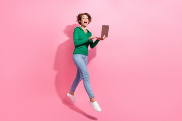 Sticker - Full body length photo of funky girl jumping up with her laptop working everywhere remote job advantage isolated on pink color background