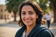 © ThomasLENNE - Close portrait of a smiling 40s Egyptian woman looking at the camera, Egyptian outdoors blurred background