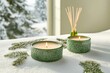 © ElenaX - Tranquil winter candles aroma diffuser on snowy windowsill