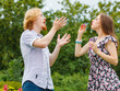 © Voyagerix - Couple blowing soap bubbles, having fun